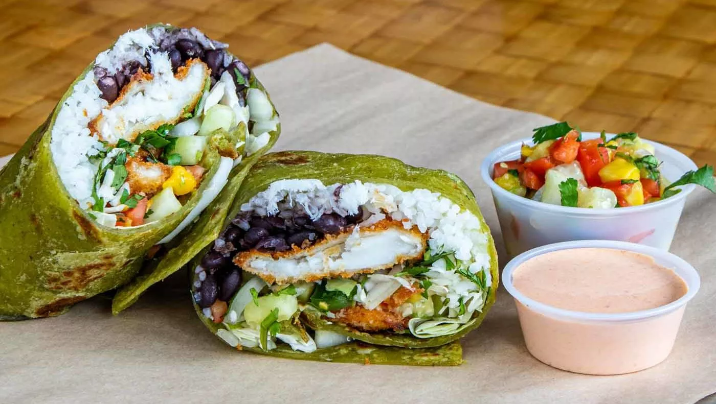 Bob's Specials 4 Fish burrito next to small containers of sauce and pico de gallo.