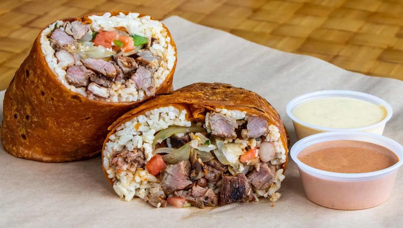 Bob's Specials 7 Steak burrito next to small containers of sauce.