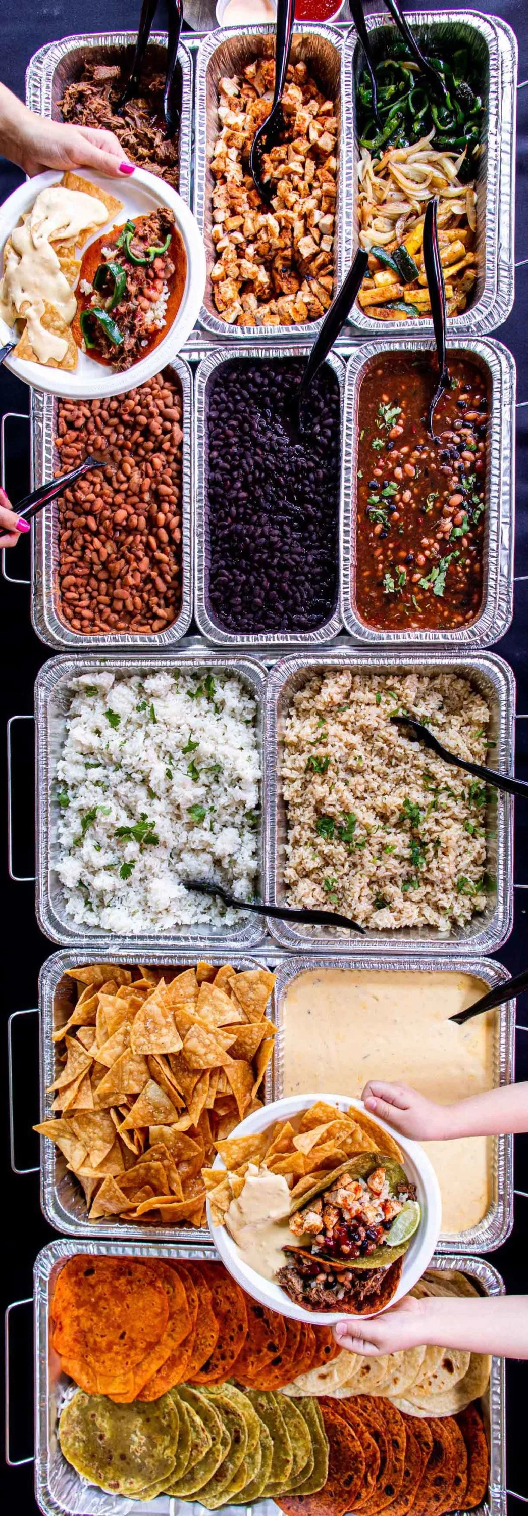 Catering trays of rice, beans, tortillas, etc.